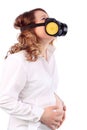 Pregnant suffering woman and respirator holds belly