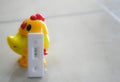 Pregnant test with a toy doll yellow chick