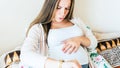 Pregnant time go hospital. Pregnant holding baby belly, woman watching clock. Childbirth time, contractions pain Royalty Free Stock Photo