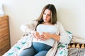 Pregnant time go hospital. Pregnant holding baby belly, woman watching clock. Childbirth time, contractions pain Royalty Free Stock Photo