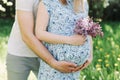 Pregnant wife with husband. Man touching belly of pregnant woman. Family couple waiting for baby. Royalty Free Stock Photo