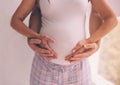 Pregnant wife with husband. Man touching belly of pregnant woman. Family couple waiting for pregnancy Royalty Free Stock Photo