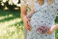 Pregnant wife with husband. Man touching belly of pregnant woman. Family couple waiting for baby. Royalty Free Stock Photo