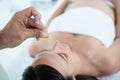 Pregnant woman in an acupuncture therapy Royalty Free Stock Photo