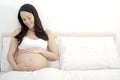 Pregnant woman admiring her bump Royalty Free Stock Photo