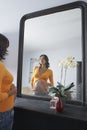 Pregnant Woman Admiring Stomach In Mirror