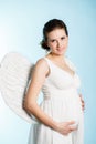 Pregnant woman with angel wings Royalty Free Stock Photo
