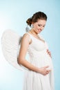 Pregnant woman with angel wings Royalty Free Stock Photo