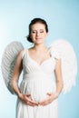 Pregnant woman with angel wings Royalty Free Stock Photo