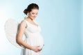 Pregnant woman with angel wings Royalty Free Stock Photo