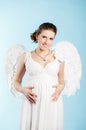 Pregnant woman with angel wings Royalty Free Stock Photo