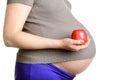 Pregnant woman with apple Royalty Free Stock Photo