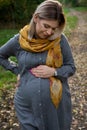 Pregnant woman in an autumn fairy tale