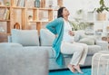 Pregnant, woman and back pain with a mother feeling painful body while sitting on her couch. Ache, inflammation and Royalty Free Stock Photo