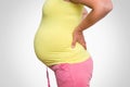 Pregnant woman with backache - body pain concept Royalty Free Stock Photo