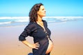 Pregnant woman on the beach at the atlantic ocean Royalty Free Stock Photo