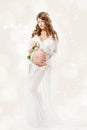 Pregnant woman. Beautiful pregnancy: long curly hair and chiffon