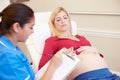 Pregnant Woman Being Given Ante Natal Check By Nurse Royalty Free Stock Photo