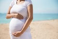 Pregnant woman belly in the beach Royalty Free Stock Photo