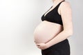 Pregnant woman belly over white background Royalty Free Stock Photo