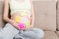 Pregnant woman belly with question mark. Pregnancy and thinking problem Royalty Free Stock Photo