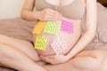 Pregnant woman belly with question mark. Pregnancy and thinking problem Royalty Free Stock Photo