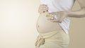 Pregnant woman belly with the week number 20 Royalty Free Stock Photo