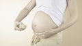 Pregnant woman belly with the week number 15 Royalty Free Stock Photo