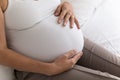 Pregnant woman big 9 month baby bump under white cloth Royalty Free Stock Photo