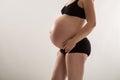 Pregnant woman in black underware Royalty Free Stock Photo