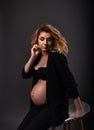 Vertical portrait of a stunning young pregnant woman Royalty Free Stock Photo