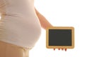 Pregnant woman with blank chalkboard