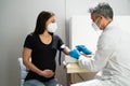 Pregnant Woman Blood Draw By Doctor In Laboratory