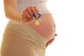 Pregnant woman with blue pacifier Royalty Free Stock Photo