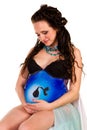 Pregnant woman with body-art with black stork