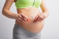 Pregnant woman breaking cigarette Royalty Free Stock Photo