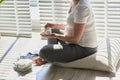 Pregnant woman browsing all bought baby clothes