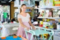 Pregnant woman buying changing table for baby at kids mall Royalty Free Stock Photo