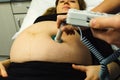 Pregnant woman checked by midwife