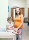 Pregnant woman with child at the clinic
