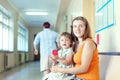 Pregnant woman and child with urinalysis sample Royalty Free Stock Photo