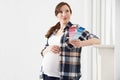 Pregnant Woman Choosing Color Scheme Fort Baby's Room