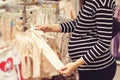 Pregnant woman choosing dress and bodysuits at clothing store. Baby fashion, shopping time, sale and pregnancy concept Royalty Free Stock Photo