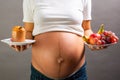 Pregnant woman choosing healthy food Royalty Free Stock Photo