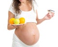 Pregnant woman choosing between healthy food and cake iso Royalty Free Stock Photo