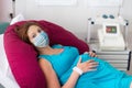 Pregnant woman in clinic wearing face mask