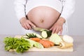 Pregnant woman cooking Royalty Free Stock Photo