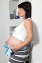 The pregnant woman costs at a wall Royalty Free Stock Photo