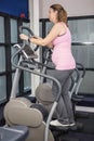 Pregnant woman on crosstrainer