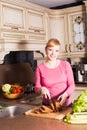 Pregnant woman is cooking Royalty Free Stock Photo
